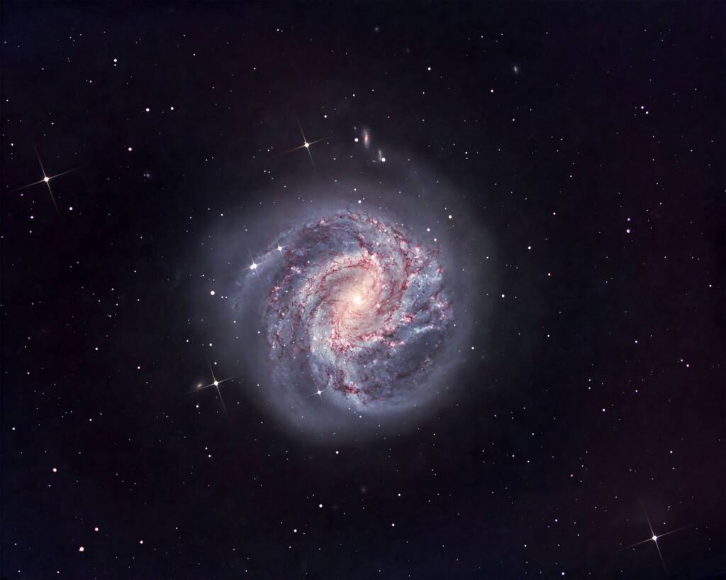 Southern Pinwheel Galaxy — A Spiral of Light and Dust